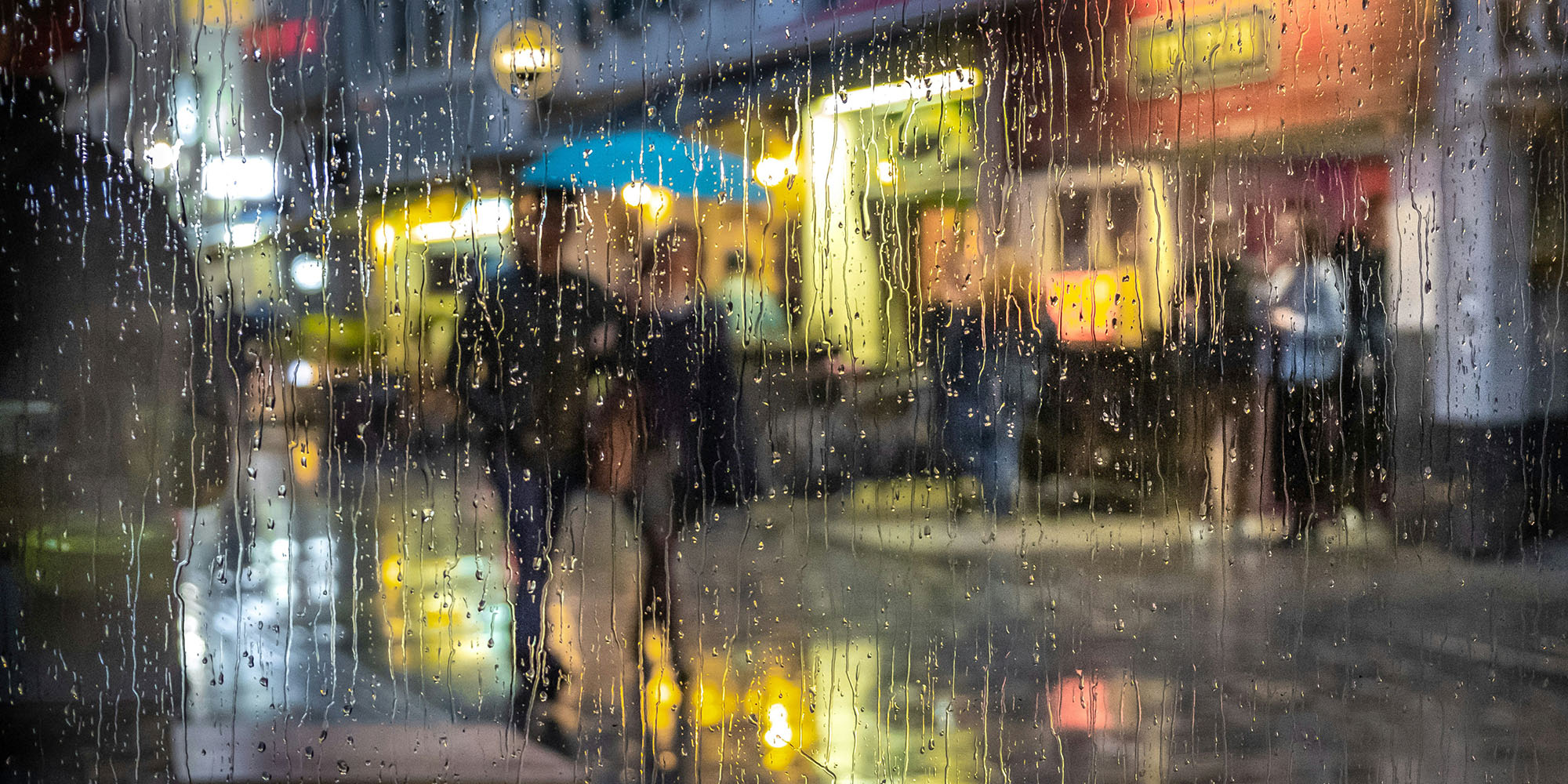 Hey Siri, give us weather reports that work outside California | A rainy night viewed through rain-streaked glass