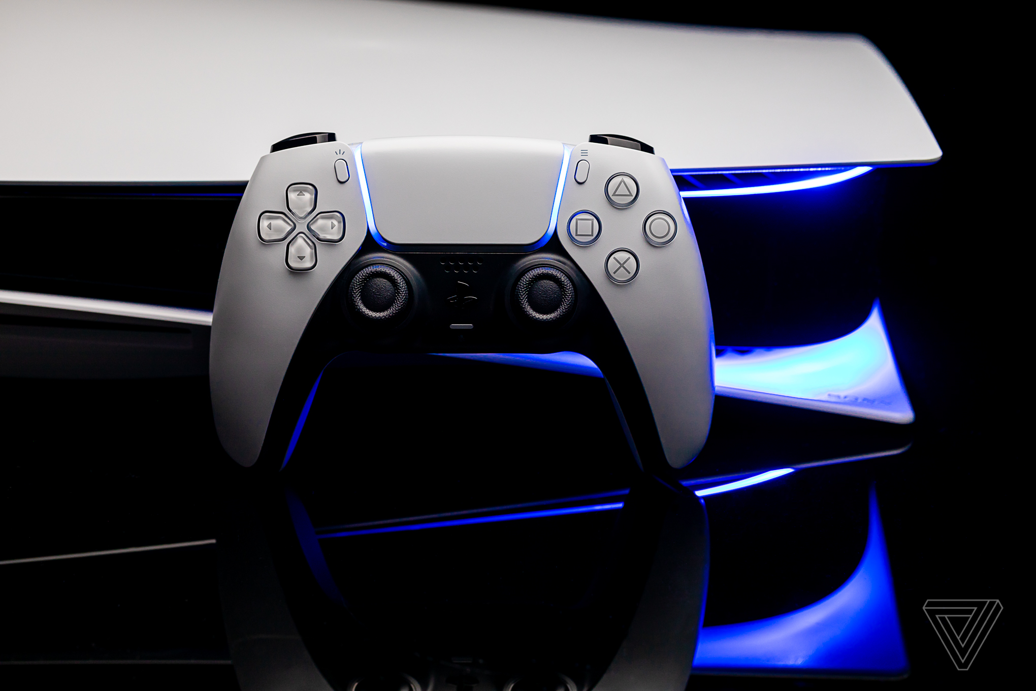 PlayStation 5 DualSense controller rests on a PlayStation 5 console.